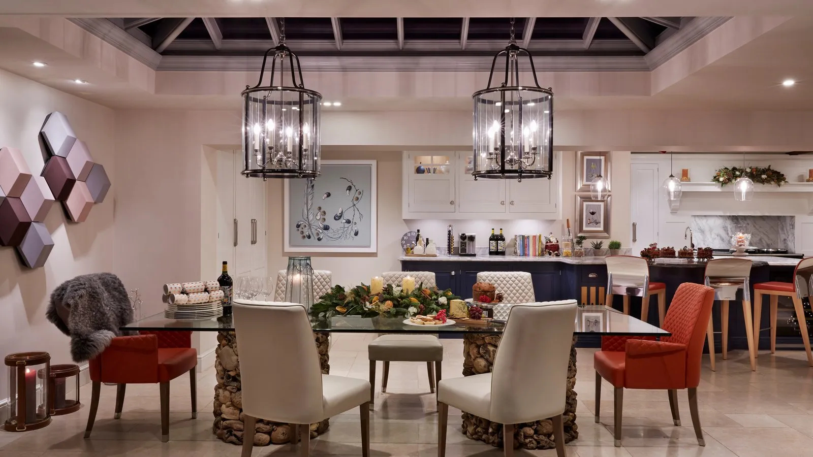 A full-width view of the open-plan kitchen orangery showing the dining area, pendant lanterns and connection to the kitchen - Atlantic Interiors, Kent