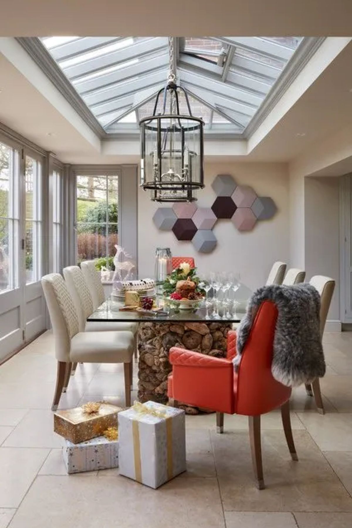 The Kitchen Orangery dining area from an alternative angle - showing the pendant lanterns, dining table and connection to the garden, Kent
